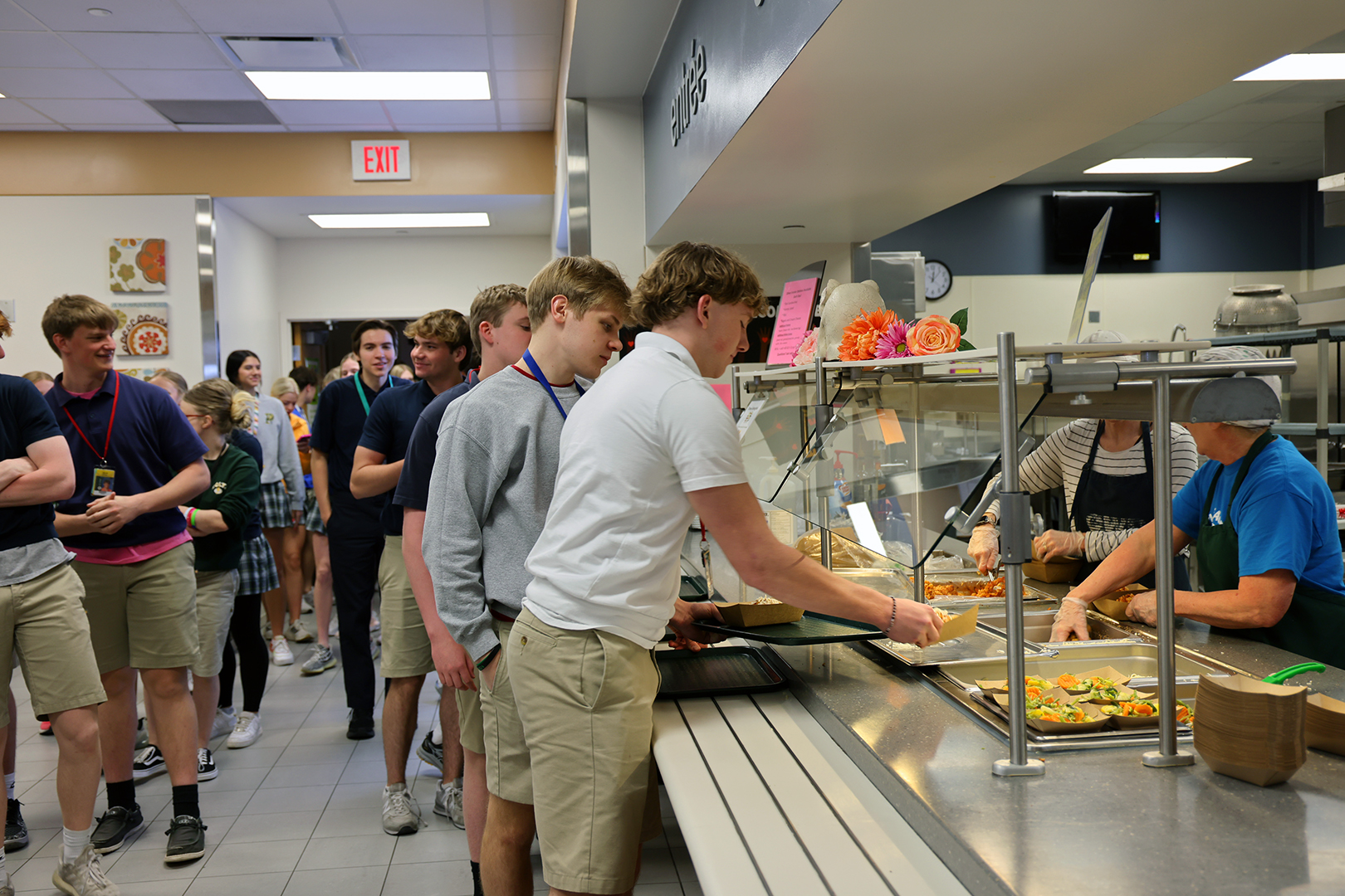 Students receive school lunch at Pius X High School in Lincoln, Neb.