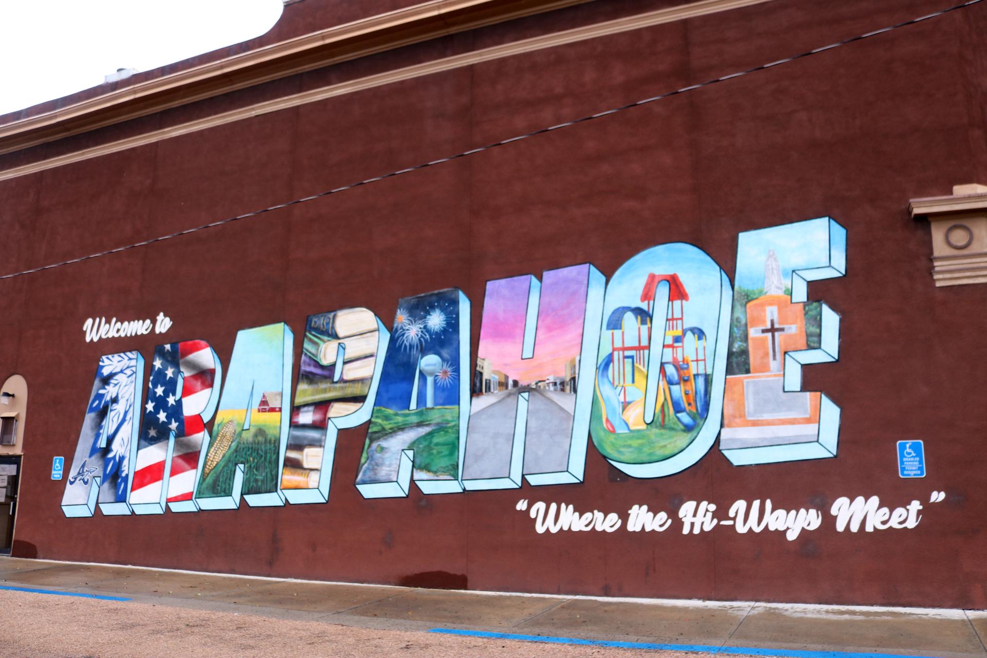 In 2020, fellows Aline Abayo and Megan Tofflemire commissioned a mural in Arapahoe that displays landmarks unique to the area.