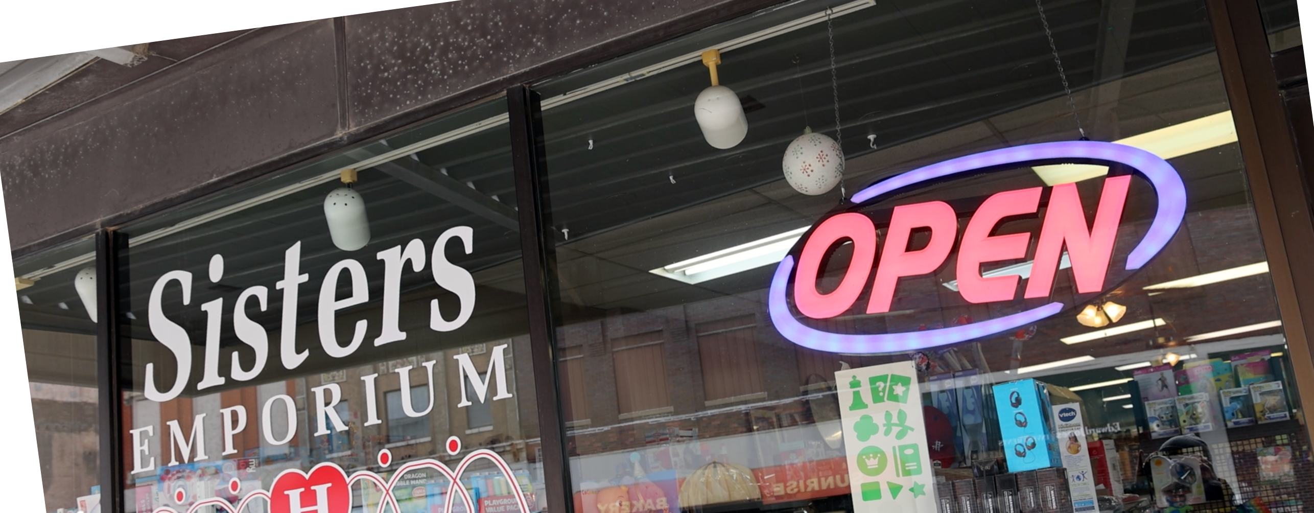 Sisters Emporium Open sign in Beatrice, Neb.