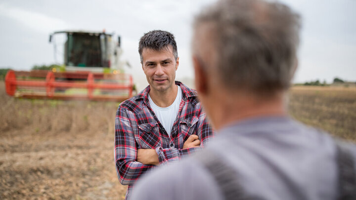 Stock photo of two farmers talking.