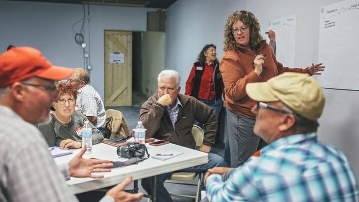 Community members discuss sidewalk changes during the Valentine workshop. photo copyright P&W Photography.