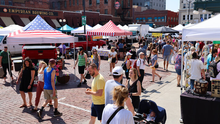 Marker goers walk the streets of the Saturday morning Haymarket Farmers Market in Lincoln.