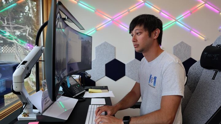 Cody Lawson works on his computer at 1to1 Technologies in Central City, Nebraska. He credits mentorship from Doris Lux, an eCoach with Rural Prosperity Nebraska’s eCommunities entrepreneurship program, as a key contributor to his startup’s growth. Photo by Russell Shaffer