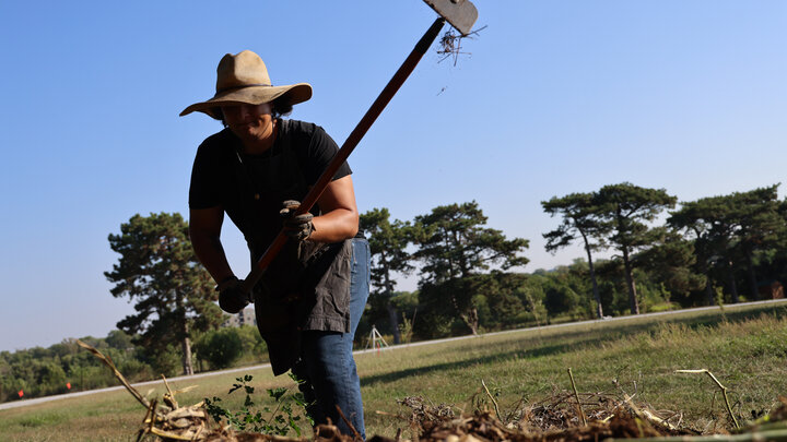 Timothy Thielen breaks up a compost pile as part of the Indigenous Youth Food Sovereignty Program. 