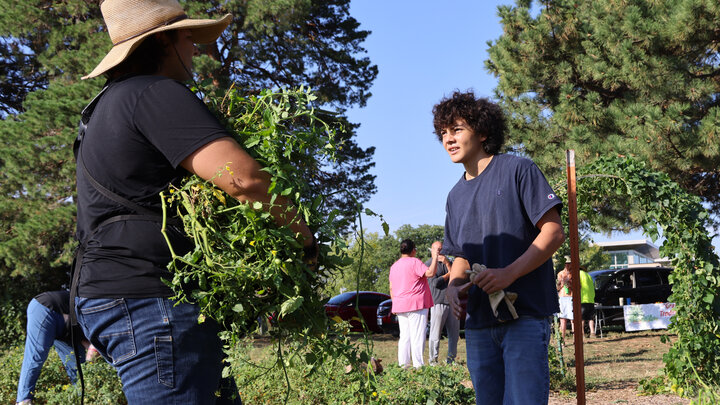 Timothy Thielen (left) talks with a member of the Turtle Island Indigenous Youth Growers. Part of the Turtle Island Trade Coalition, the Youth Growers group plants, tends, harvests and sells its produce from a garden on the University of Nebraska–Lincoln’s East Campus.