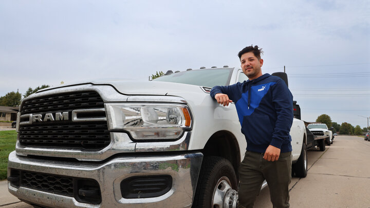 Joel Yera stands next to one of his two trucks that he drives as part of his business Yera Transportation in Grand Island, Neb. Photo by Russell Shaffer