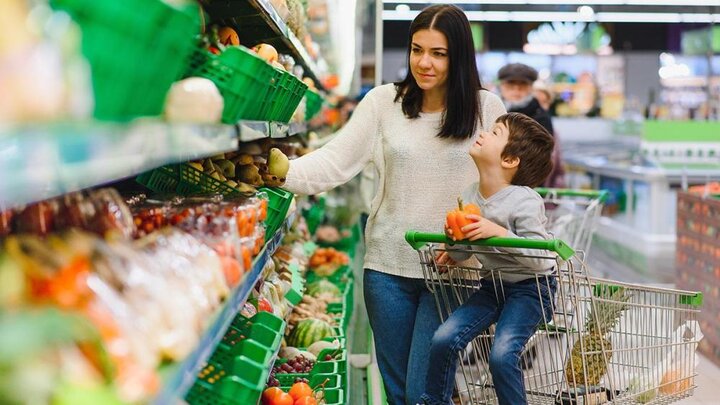 Adobe stock image of mother and son in grocery store.