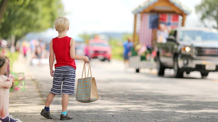 Adobe stock image of boy at a parade.