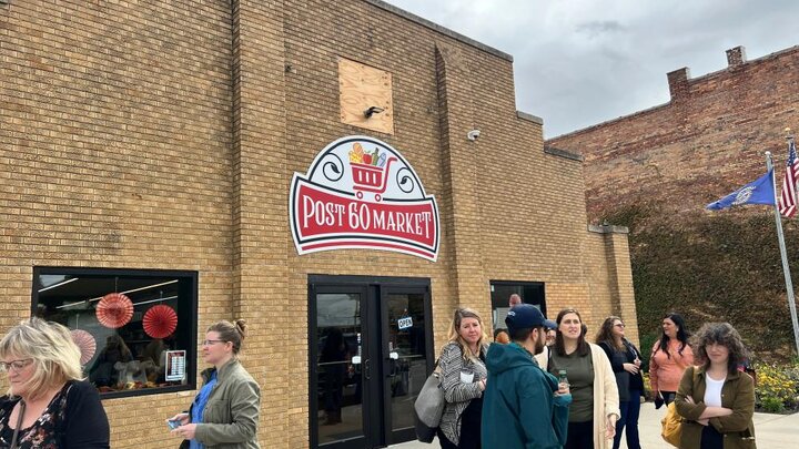 Emerson residents stand outside the new Post 60 Market cooperative grocery store in Emerson, Neb.