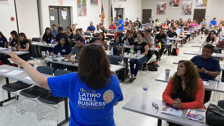 Sandra Barrera, Rural Prosperity Nebraska Extension educator, welcomes attendees to the 2022 Latino Small Business Conference in Omaha.