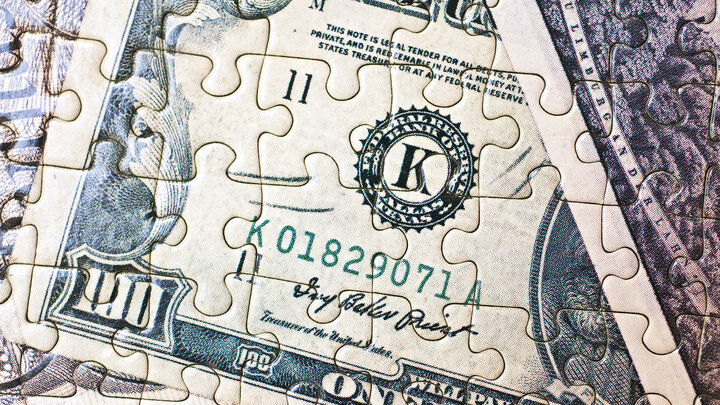 Stock photo of money as a puzzle.