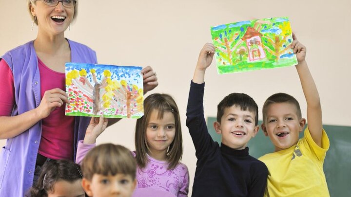 Stock photo of teacher and preschool children.