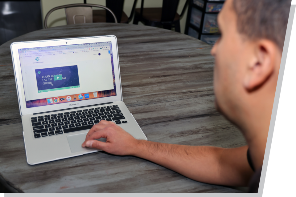 A man works on his laptop.
