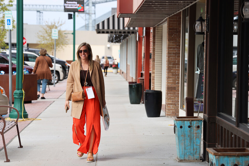 An attendee at the 2025 CEC Conference in North Platte, Neb. walks down the street in the city's Canteen District. Photo by Russell Shaffer