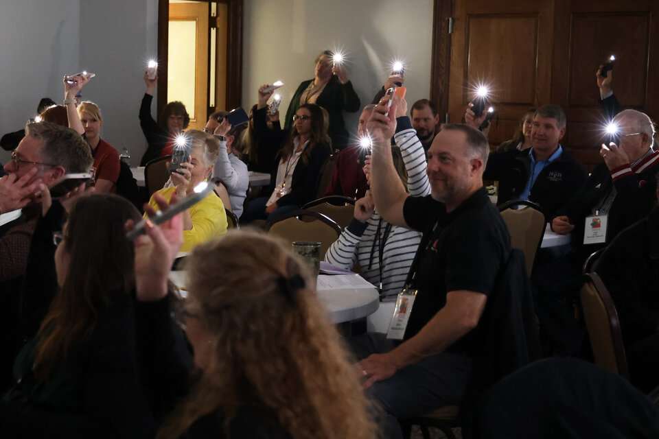 Attendees take a poll with lights from their cell phones at the 2025 CEC Conference in North Platte, Neb. Photo by Russell Shaffer